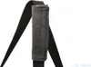 A close-up view of a black strap with a padded gray handle, likely part of a dog car seat or carrier. Produktbild-Vorschau