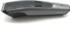 A close-up, side view of a gray electric beard trimmer on a white background. Produktbild-Vorschau
