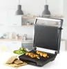 A kitchen counter with a grill and food. Podgląd zdjęcia produktu