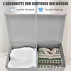 A close-up of a gray, two-compartment laundry basket with clothes inside. Produktbild-Vorschau