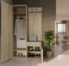 A hallway furniture unit with storage for coats, shoes, and accessories, placed in a modern interior setting. Produktbild-Vorschau