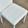 A close-up view of the white seat of a chair. Produktbild-Vorschau