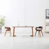 A dining set with two chairs and a table in a minimalist room. Produktbild-Vorschau