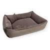 A brown dog bed with a textured interior and a small pillow.