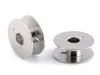 Two silver metal sewing machine bobbins on a white background. Produktbild-Vorschau