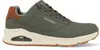 A side view of a green Skechers Uno sneaker with a cream sole and brown accents. Voir les images du produit