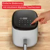 A hand is shown pressing a button on the digital touchscreen of a white and black air fryer, which is placed on a wooden surface. Red text overlays are present at the top of the image. Produktbild-Vorschau