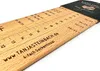 A wooden sock ruler with size markings and website information engraved on it. Produktbild-Vorschau