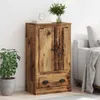 A wooden cabinet with two drawers and a door, placed next to a sofa and a potted plant. Produktbild-Vorschau