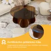 A round coffee table with a dark glass top and a wooden base, placed in a living room setting with a sofa and a rug. There is a close-up inset of the table edge and text overlay describing its features. Produktbild-Vorschau