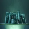 A collection of Aveda Botanical Repair hair care products displayed on a shelf with green lighting. Anteprima dell’immagine prodotto