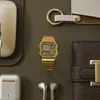A collection of personal accessories arranged on a brown surface. Voir les images du produit
