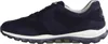 A side view of a navy blue sneaker with a white sole. Voir les images du produit