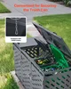 A grey trash can enclosure with two open compartments, one containing a green bin filled with recyclables, and the other with compostable waste. The enclosure is situated outdoors on a paved area next to a grassy lawn. Produktbild-Vorschau