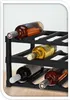 A black plastic wine rack holding several bottles of wine. Produktbild-Vorschau
