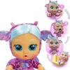 A doll with blue hair and pink dragon-like costume is shown with inset images demonstrating how to make it cry. Produktbild-Vorschau