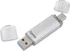 A silver USB flash drive with two caps, one on each end, is shown against a white background. The drive has both a USB-A and a USB-C connector. Produktbild-Vorschau