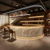 Comptoir de bar rond avec façade en pierre synthétique Voir les images du produit 3