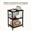 A kitchen cart with various items on its shelves, including a toaster, food items, and a picnic basket. Produktbild-Vorschau