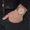 A man's hand wearing a rose gold watch is placed in his pocket. Produktbild-Vorschau