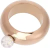 A rose gold colored bracelet flask with a crystal-encrusted cap, shown against a white background. Podgląd zdjęcia produktu