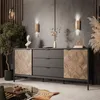 A modern living room with a sideboard, plant, and decorative items. Produktbild-Vorschau