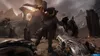 A first-person perspective of a video game scene, showing a player character holding a weapon and facing a large, monstrous enemy in a desolate, ruined landscape. Produktbild-Vorschau