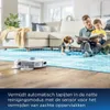 A robot vacuum cleaner is cleaning a floor in a living room while a father and son read a book and a dog rests nearby. Produktbild-Vorschau