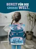 A young girl wearing a school backpack with a Stitch and Angel design, standing in a room. Produktbild-Vorschau