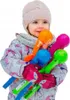 A young child holding several colorful snowball makers. Náhľad obrázku produktu