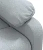 A close-up view of the fabric texture and stitching on a gray armchair. Podgląd zdjęcia produktu