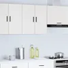 A clean, modern kitchen scene with white cabinets and appliances. Voir les images du produit