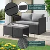 An outdoor seating set with a sofa and two ottomans on a wooden deck, with a pool and greenery in the background. Produktbild-Vorschau