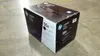 A black and white HP LaserJet toner cartridge box is placed on a concrete floor. Náhľad obrázku produktu