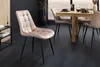 A dining room setting with a wooden table and chairs. Produktbild-Vorschau