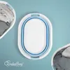 A top-down view of a folded laundry basket with two other laundry baskets filled with clothes on either side, set against a light blue background. Produktbild-Vorschau