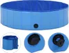 A blue foldable dog pool is shown from multiple angles, including a close-up of the drain valve. Voir les images du produit