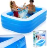 Two young people are splashing water in an inflatable swimming pool. Produktbild-Vorschau