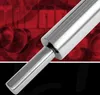 A close-up shot of a stainless steel rolling pin against a red and black background with abstract shapes. Anteprima dell’immagine prodotto