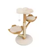 A multi-tiered cat tree with baskets and a hanging toy, presented on a white background. Produktbild-Vorschau