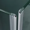 Close-up view of two glass shower door profiles with aluminum framing and black sealing strips. Produktbild-Vorschau