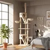 A cat tree is set up in a bedroom next to a large window and a bed. Produktbild-Vorschau