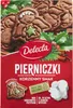 A close-up of a box of Delecta gingerbread cookies, featuring images of the cookies and festive decorations. Podgląd zdjęcia produktu