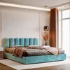 A modern bedroom with a turquoise upholstered bed. Anteprima dell’immagine prodotto