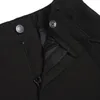 A close-up view of the zipper and button closure of black children's softshell pants. Produktbild-Vorschau