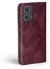 A close-up side view of a burgundy flip case for a smartphone, showing the camera module and side buttons. Produktbild-Vorschau