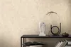 A shelf with decorative items against a textured wall. Produktbild-Vorschau