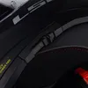 A close-up view of the interior and exterior of a black motorcycle helmet. Náhled obrázku produktu
