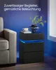 A bedside table with LED lighting next to a sofa. Produktbild-Vorschau
