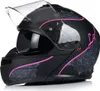 A black motorcycle helmet with pink and gray decorative patterns. Náhled obrázku produktu